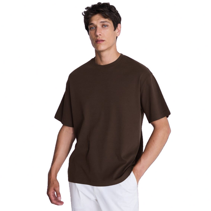 Man wearing a brown t-shirt on a white background